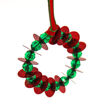 Bead and Sequin Wreath Ornament red with round green beads on display