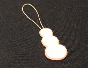 Easy Christmas crafts Button Snowman Ornament Step 6 glue yarn between felt