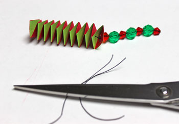 Catstep Braid and Bead Ornament step 14 tie knot to secure beads