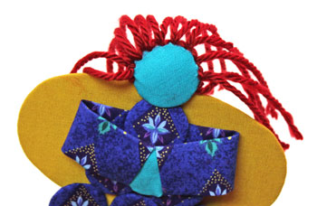 Easy Angel Crafts Yo Yo Angel Ornament step 23 finish yarn hair