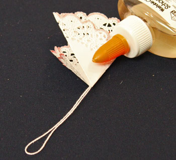 Easy Christmas Crafts Paper Doily Folded Christmas Tree Ornament step 8 apply glue under outer layer