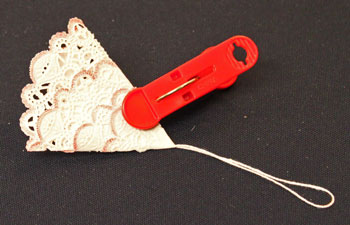 Easy Christmas Crafts Paper Doily Folded Christmas Tree Ornament step 9 hold for glue to dry