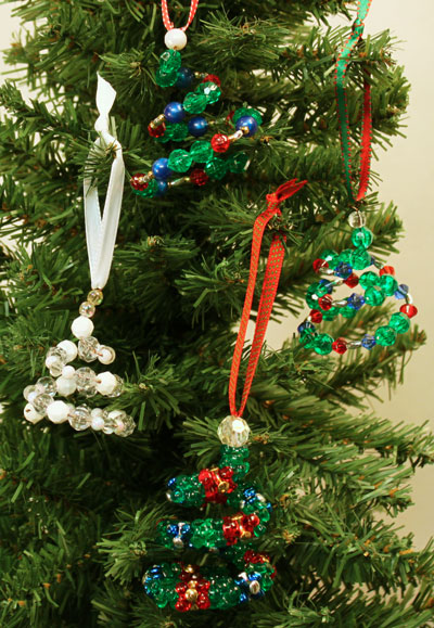 Easy Christmas Crafts Spiral Beaded Christmas Ornament four finished ornaments hanging on tree
