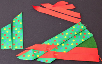 Easy Christmas Crafts Woven Ribbon Christmas Tree Door Hanger step 7 add next ribbon to weave