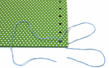 Easy paper crafts pocket calendar step 12 begin lacing yarn through holes