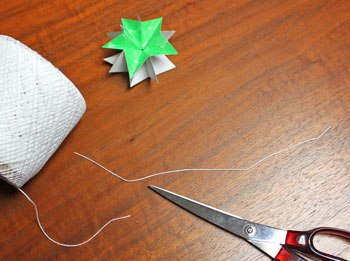 Folded Paper Squares Star step 15 cut yarn