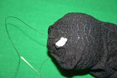 Frugal-Fun-Crafts-Mending-Socks-with-light-bulbs-trouser-sock-hole-with-bulb-anchor-thread