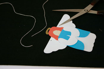 Easy Angel Crafts - Paper Angel punch holes for string