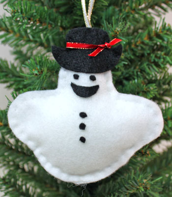 Stuffed felt snowman ornament finished on display