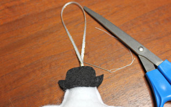 Stuffed felt snowman ornament step 10 sew ribbon loop