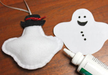 Stuffed felt snowman ornament step 13 glue face and buttons
