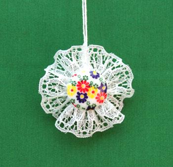 Button and Lace Ornament with flowered button on display