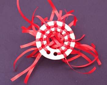 Curly Ribbon Ornament step 5 shows back of circle and ribbons