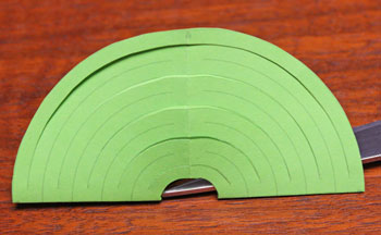 Cut Paper Circle Ornament step 7 open and fold opposite