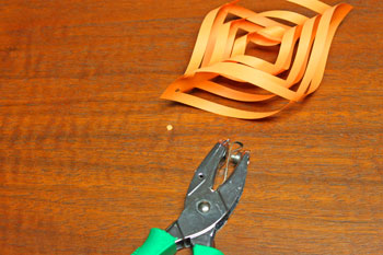 Cut Paper Square Ornament step 9 punch hole for yarn