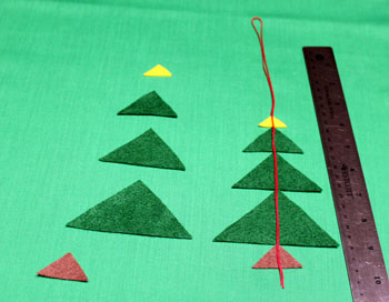 Felt Triangles Christmas Tree step 2 fold yarn over one set of triangles