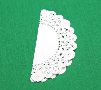 Folded Paper Doily Ornament step 1 make first fold in half