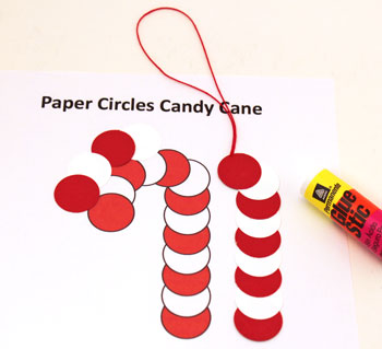 Paper Circles Candy Cane ornament step 3 add yarn loop between top circles