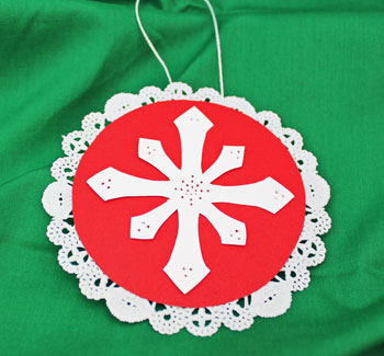 Paper Doily Snowflake Ornament step 7 finished and ready to display
