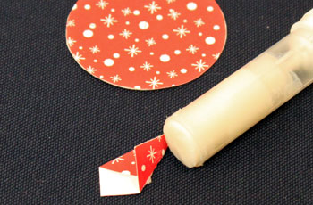 Easy Christmas Crafts Paper Pinwheel Wreath Ornament step 11 place glue on flap