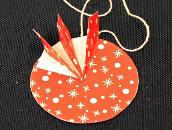 Easy Christmas Crafts Paper Pinwheel Wreath Ornament step 13 first quadrant finished